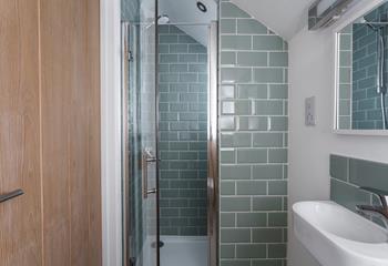 Compact but spacious, the en suite shower room offers privacy and convenience. 