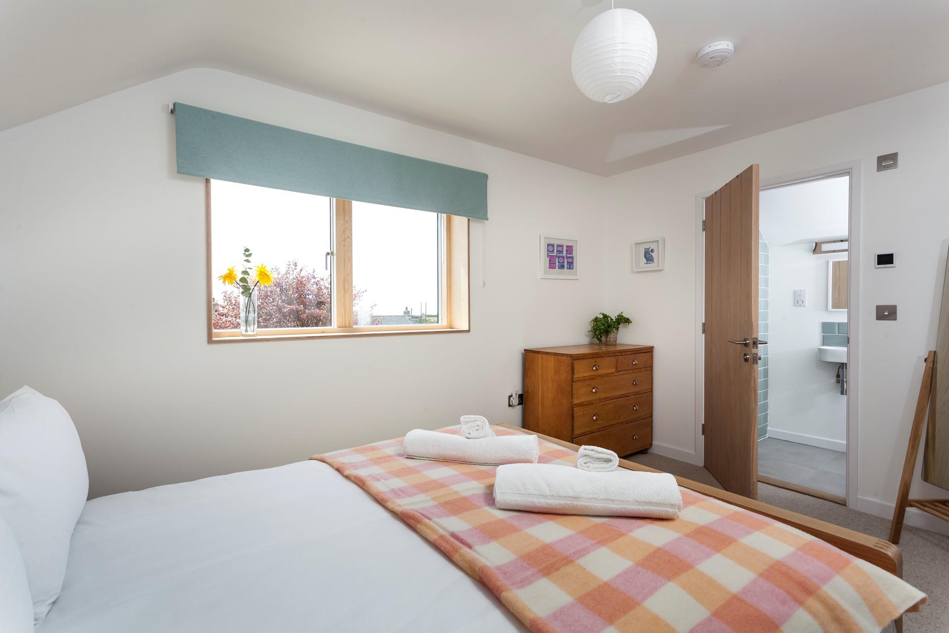 Light and spacious, bedroom 1 benefits from an en suite shower room.
