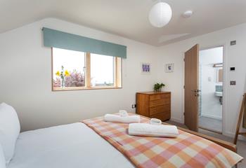 Light and spacious, bedroom 1 benefits from an en suite shower room.