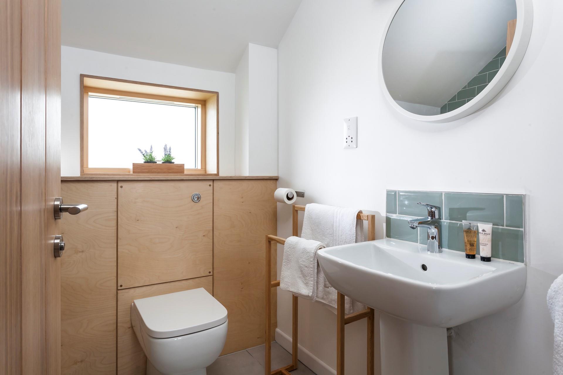Start your day with a refreshing shower in the light-filled family bathroom. 