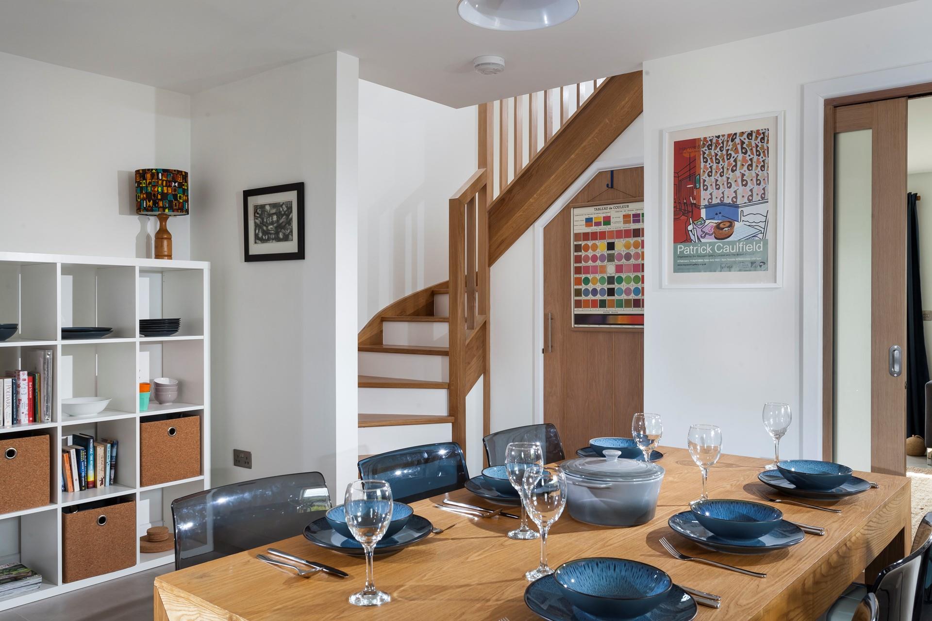 The statement spiral staircase leads to the first floor bedrooms. 