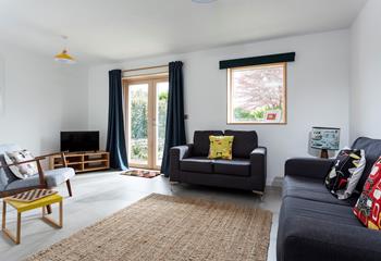 Bright and spacious, the sitting room is the perfect place to unwind after a busy day exploring west Cornwall. 