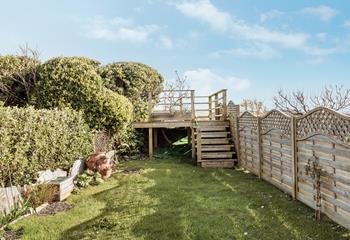 Private garden with stunning ocean and countryside views from the decked seating area.