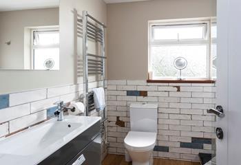 Uniquely designed, the bathroom is stylish and practical. 