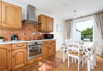 The kitchen/diner features patio doors leading onto the ground floor decking area. 