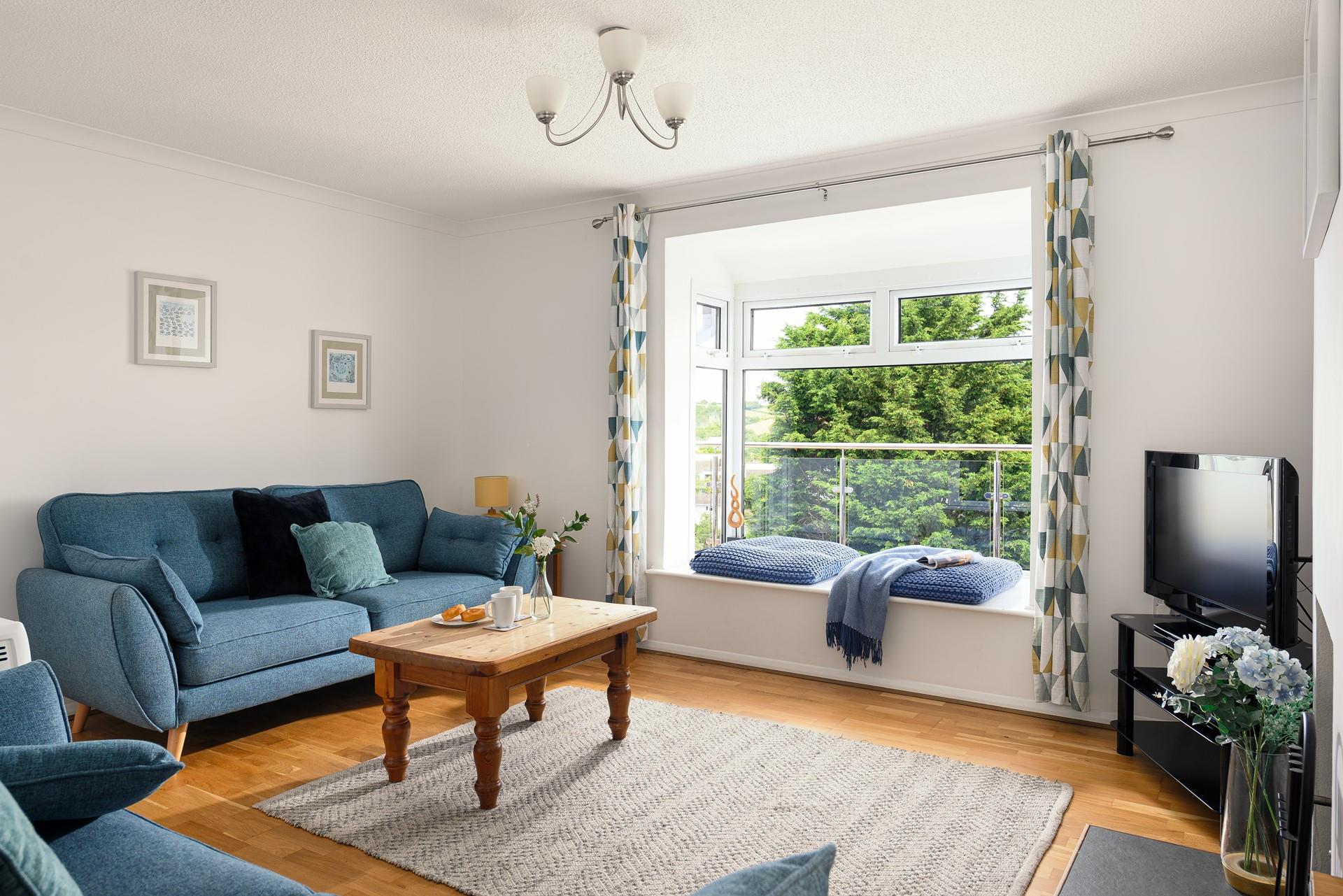Light, spacious and comfortable, the sitting room is the perfect place to relax and unwind. 