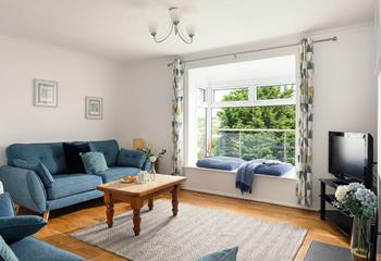 Light, spacious and comfortable, the sitting room is the perfect place to relax and unwind. 