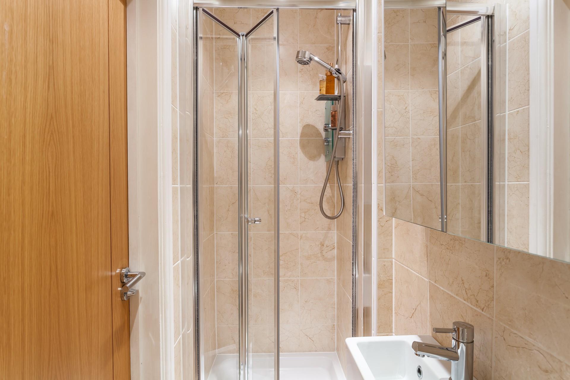 Wash off the sand in the shower and then cosy up in the sitting room.