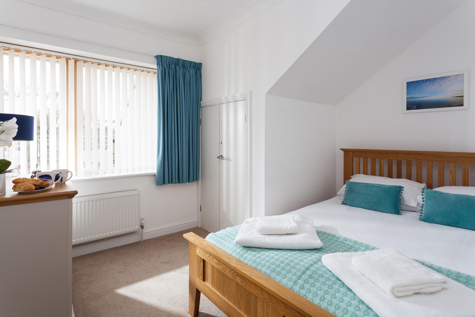 Relax in your spacious king size bed after days at the beach.