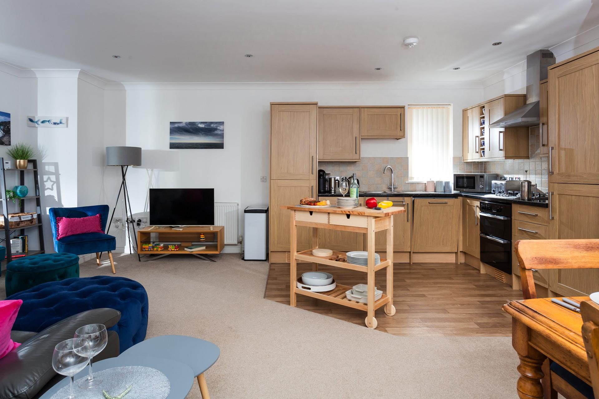 The open plan layout allows you to cook whilst still socialising.
