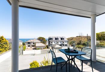 Nestled between two pillars is a private decked balcony with generous sea views. 