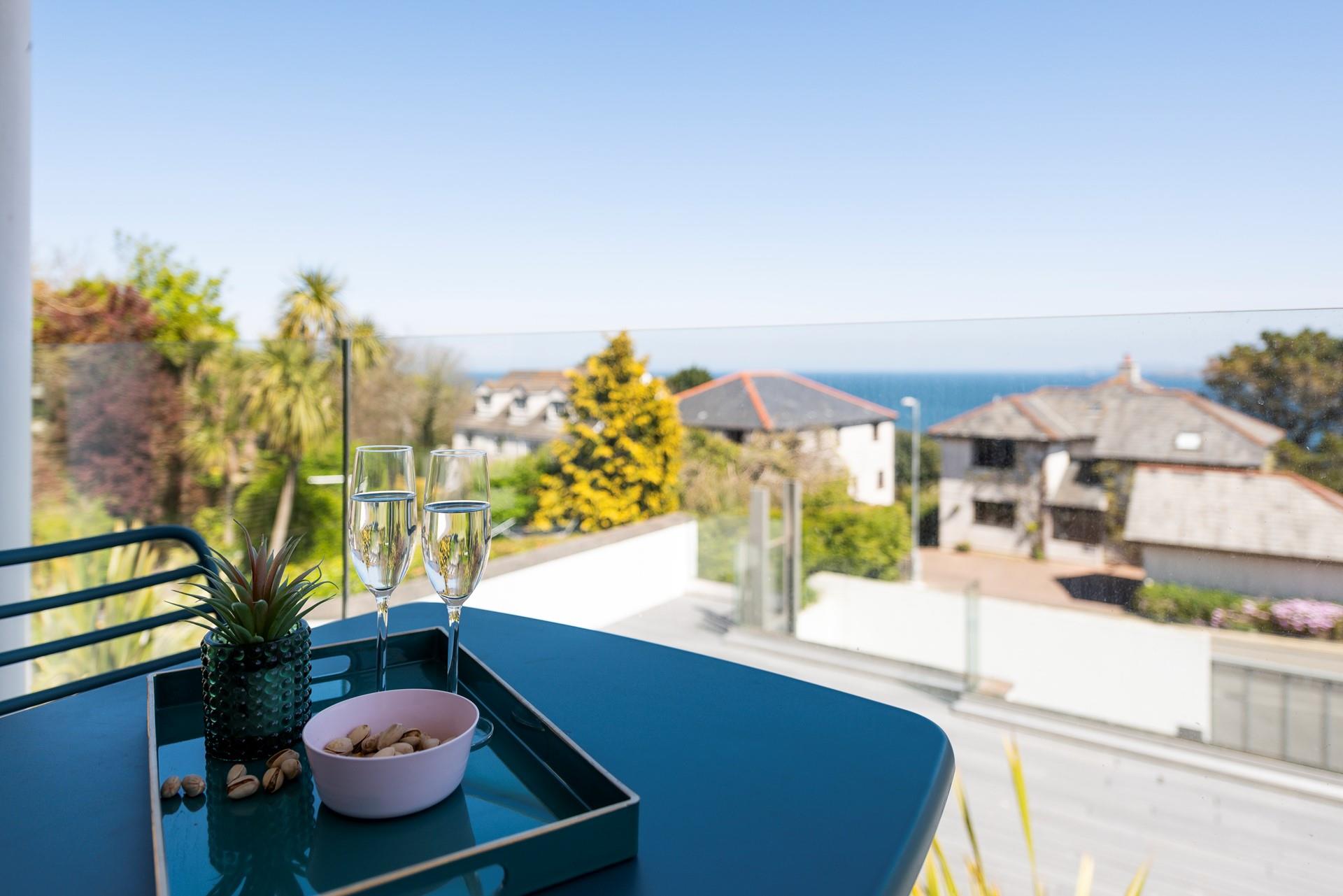 Pour a glass of bubbles and watch the sun set over the bay.