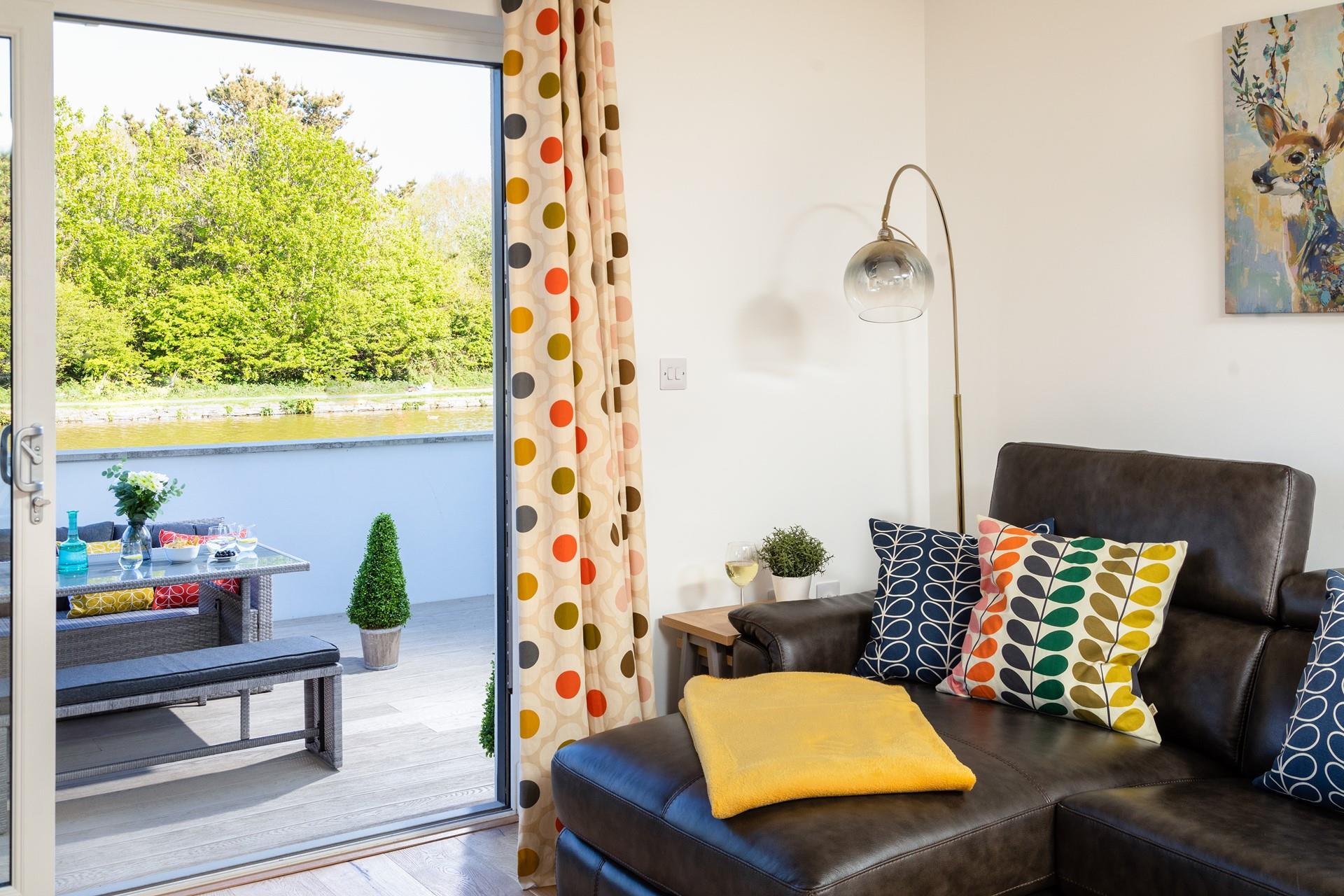 Open the patio doors and wander out to the balcony to enjoy a glass of wine as the ducks glide past.