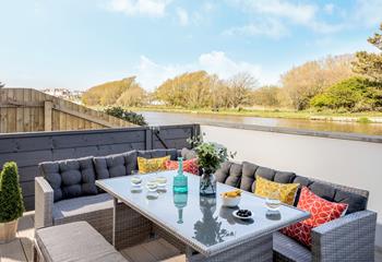 Relax on the rattan furniture overlooking the peaceful canal.