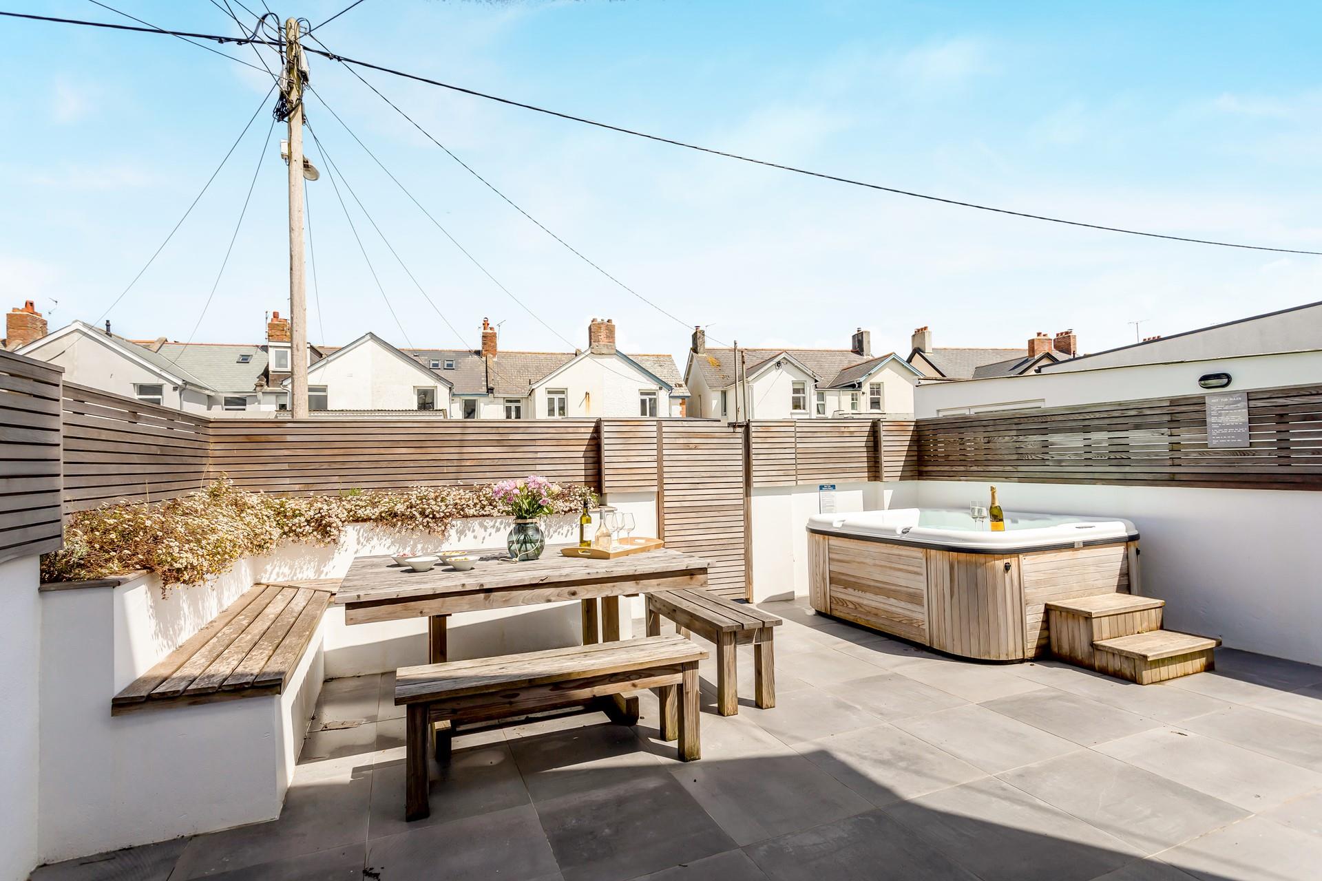 There is a large outside area perfect for alfresco dining and hot tub dipping!