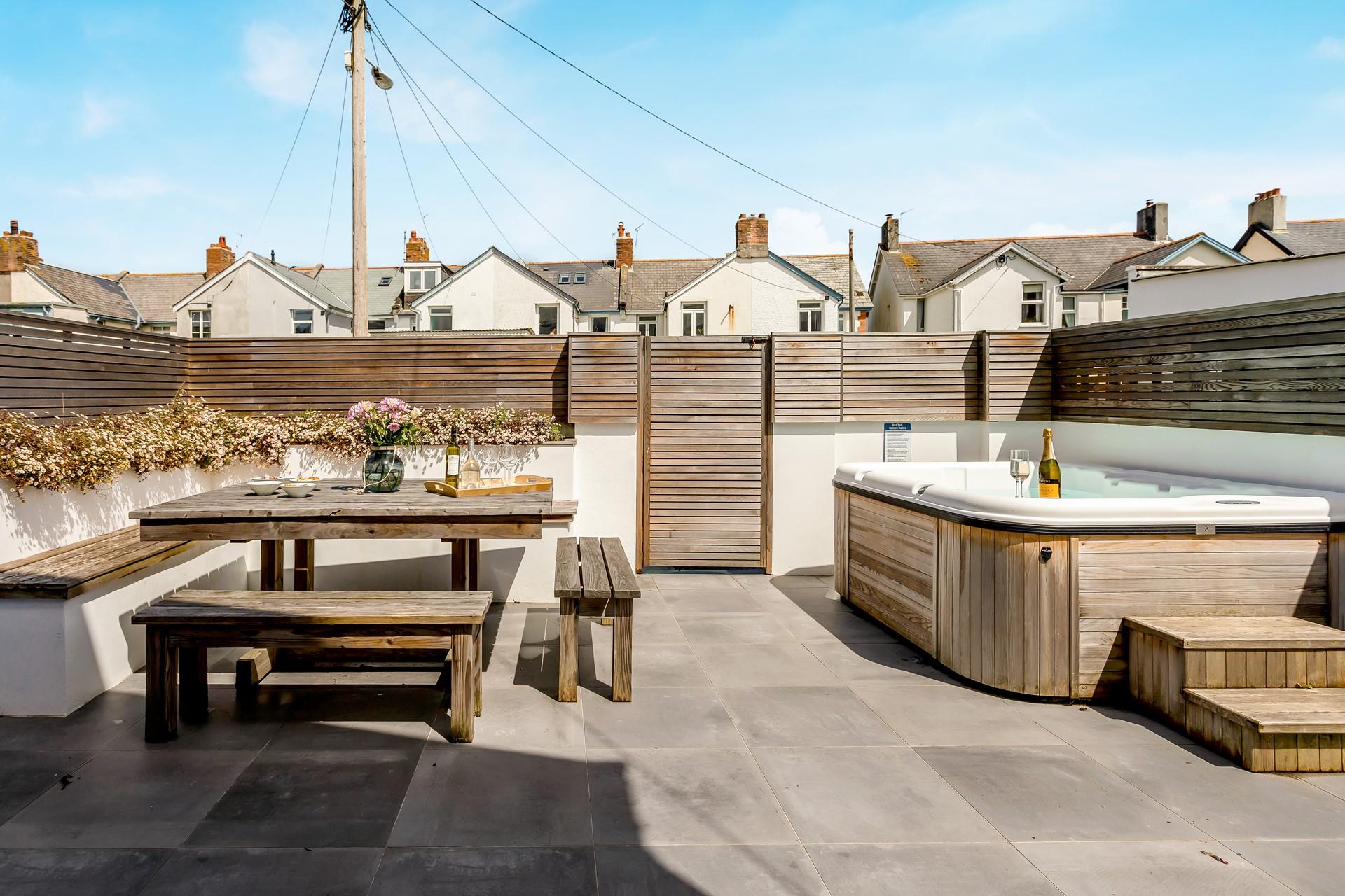 Pour a glass of bubbly and sink into relaxation mode as you unwind in the hot tub.