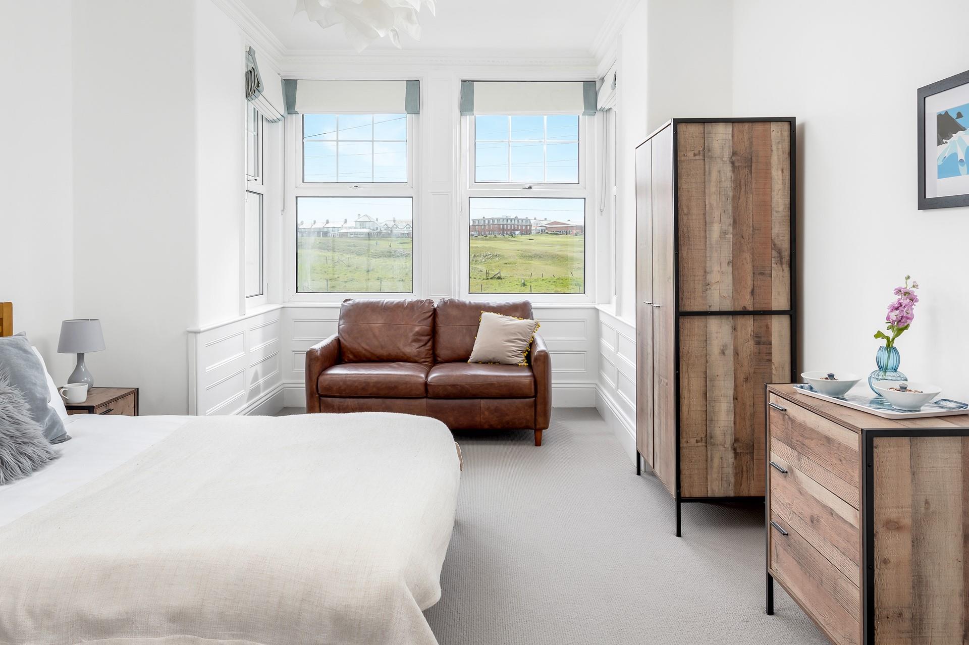 Bedroom 4 has stylish furnishings and plenty of room for clothes.