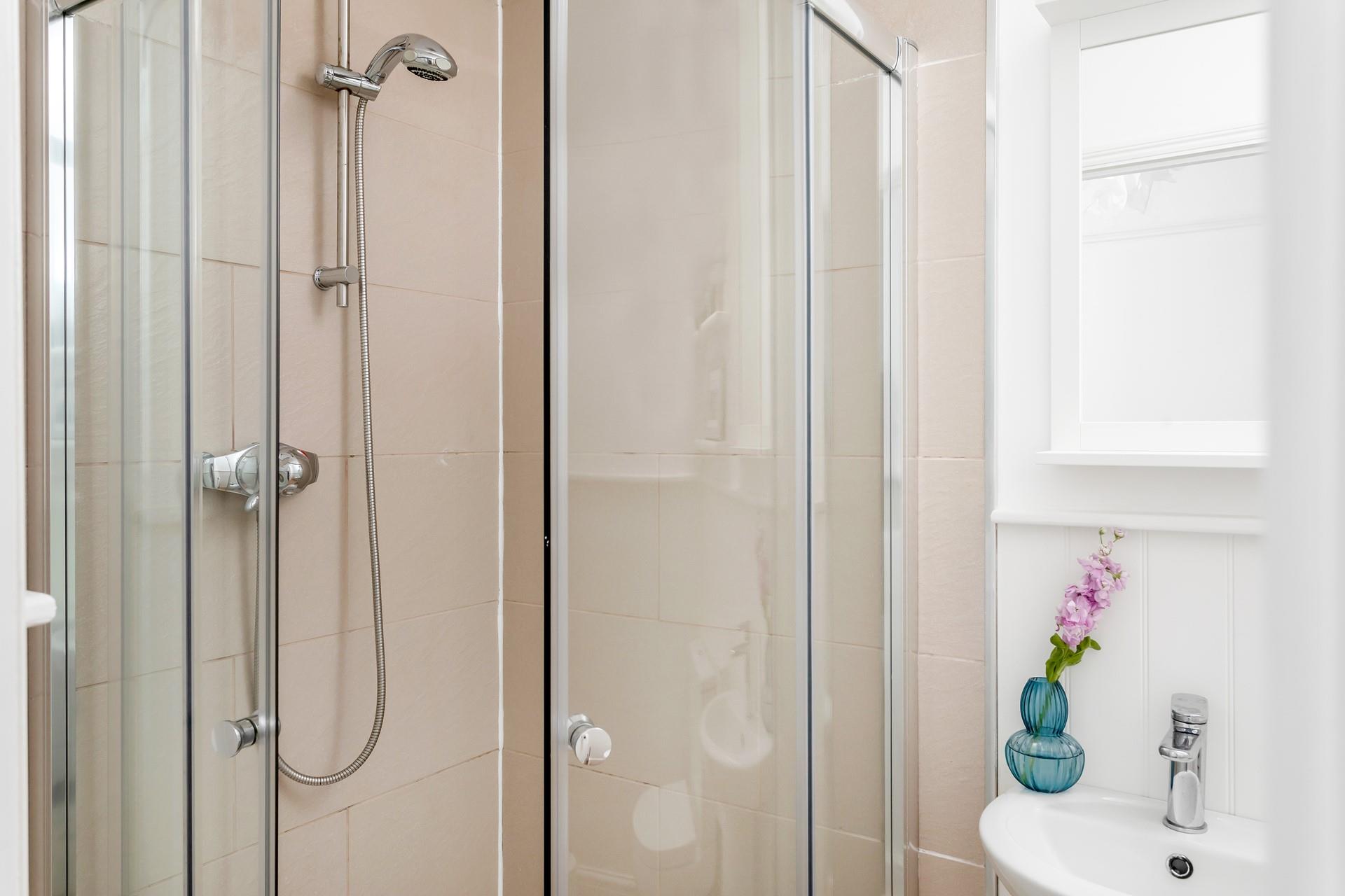 The en suite shower room has a fully enclosed shower for getting ready in the morning.