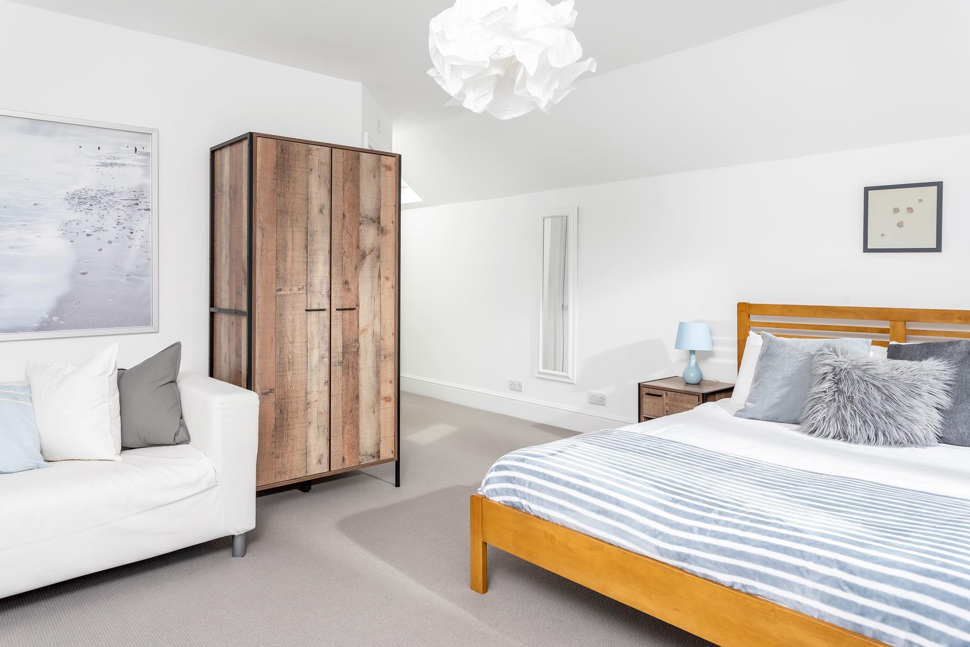 The blue decor in bedroom 2 reflects the close proximity to the beach.