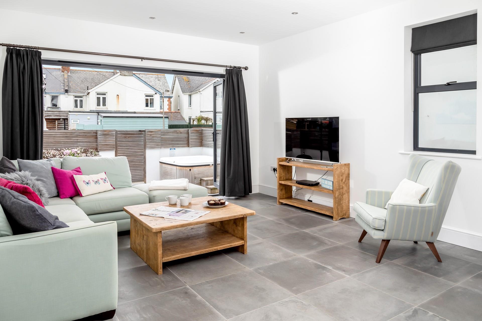 Relax on the sofa with the doors open so you can enjoy the fresh summer breeze while you sip a cuppa.