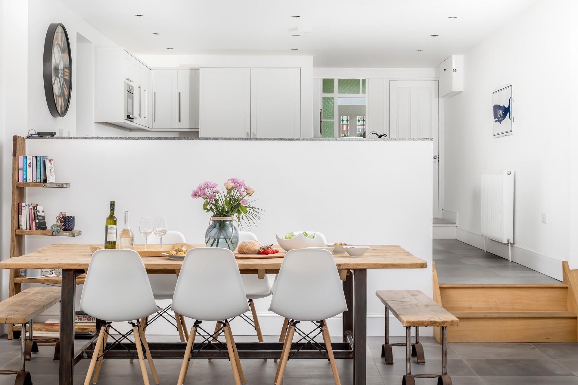 The living area is spacious and light and has a contemporary dining space for spending time as a family at meal times.