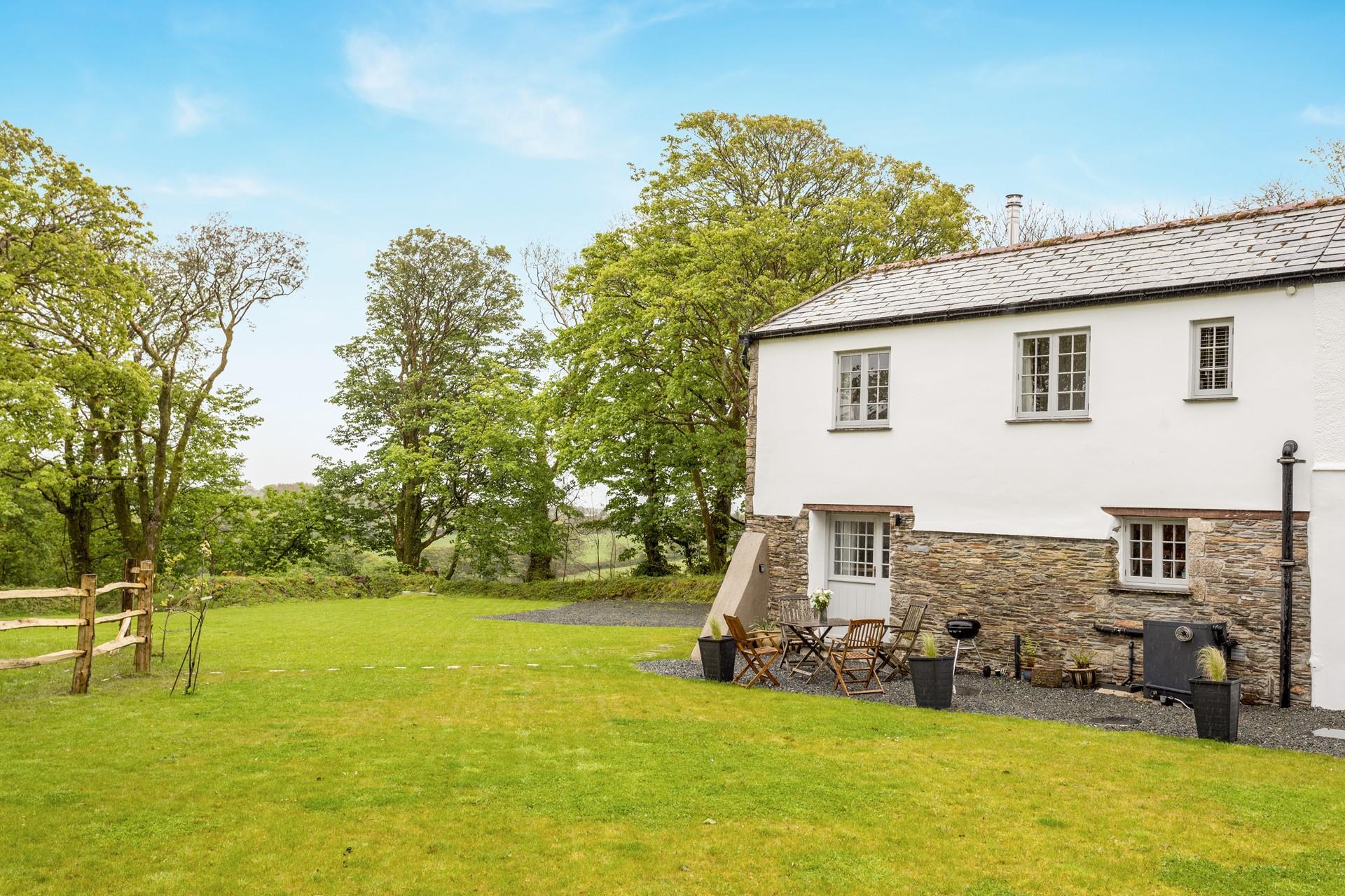 Enjoy an afternoon barbecue surrounded by leafy trees soaking up the sun.