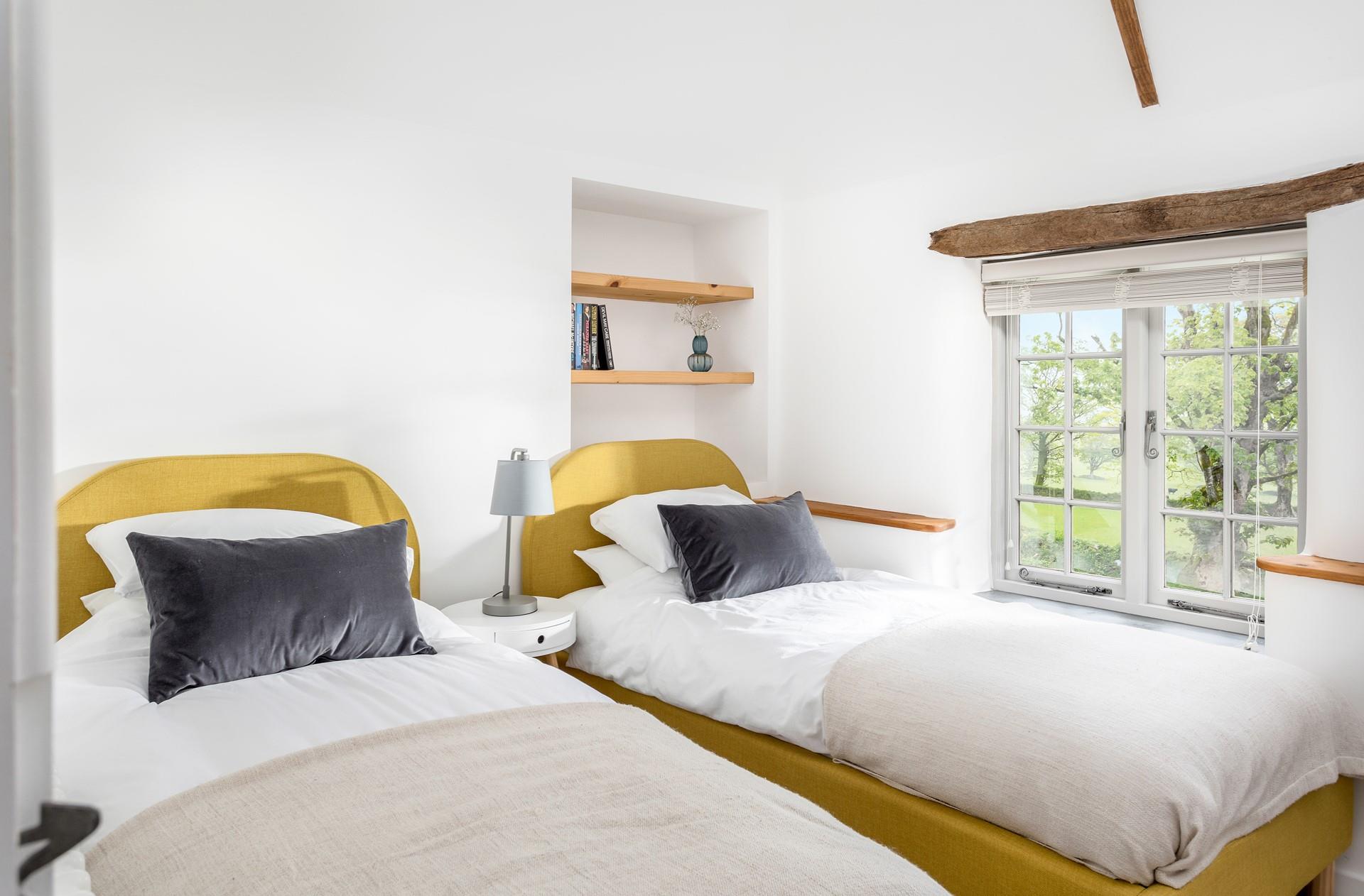 Bedroom 2 has cosy twin beds, wake up to rural views and see what wildlife you can spot.
