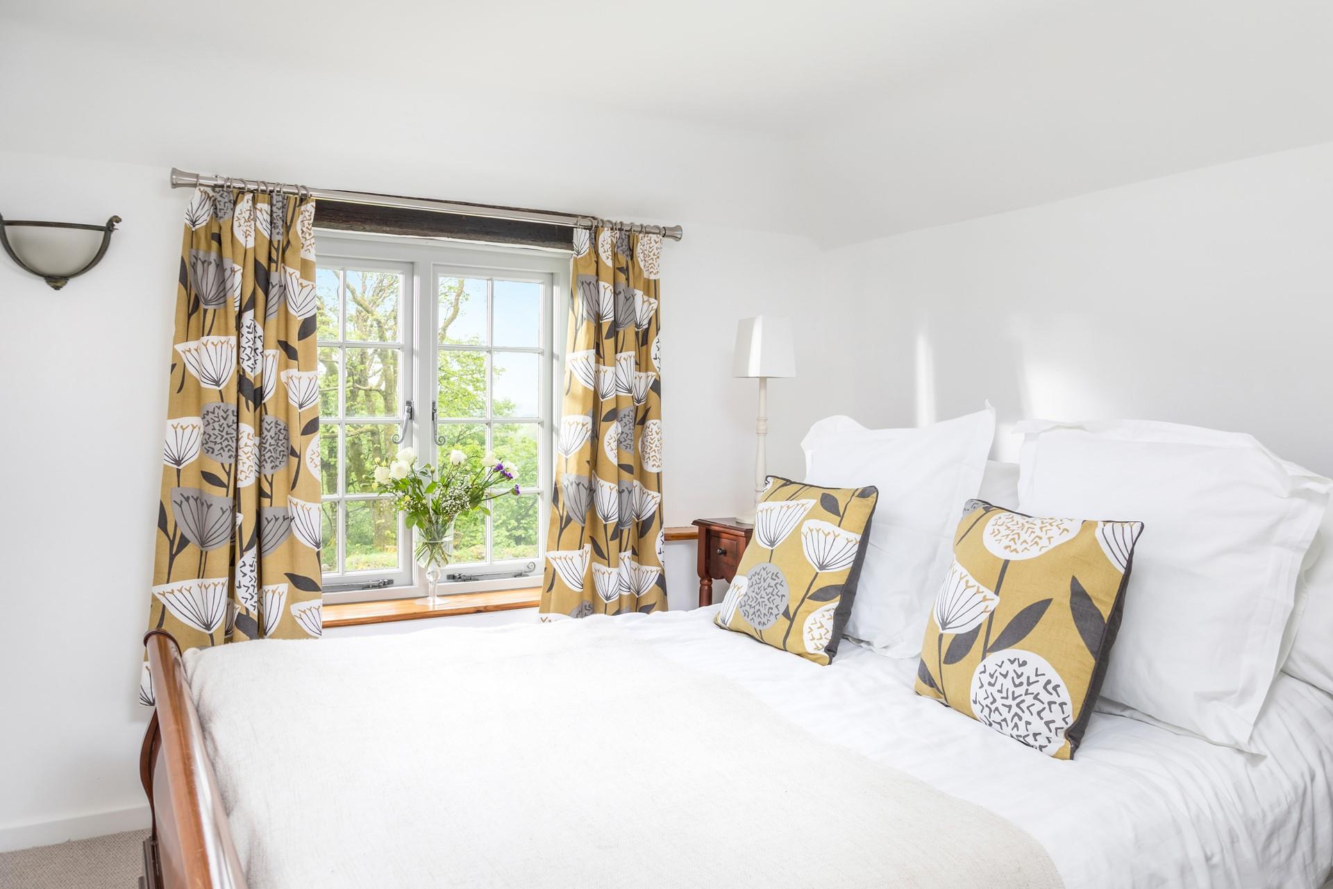 Sink into the deep sleigh bed and admire the view.