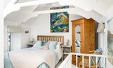 The bedroom features beautiful pastel colours creating a lovely sanctuary for 2. - Thumbnail Image