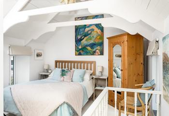 The bedroom features beautiful pastel colours creating a lovely sanctuary for 2.