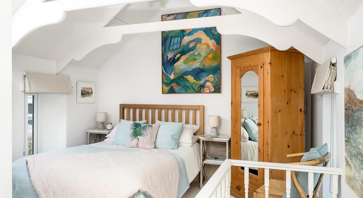 The bedroom features beautiful pastel colours creating a lovely sanctuary for 2.