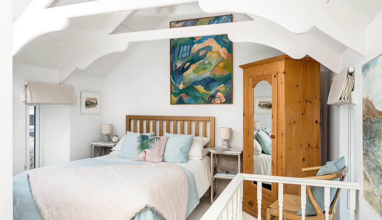 The bedroom features beautiful pastel colours creating a lovely sanctuary for 2.