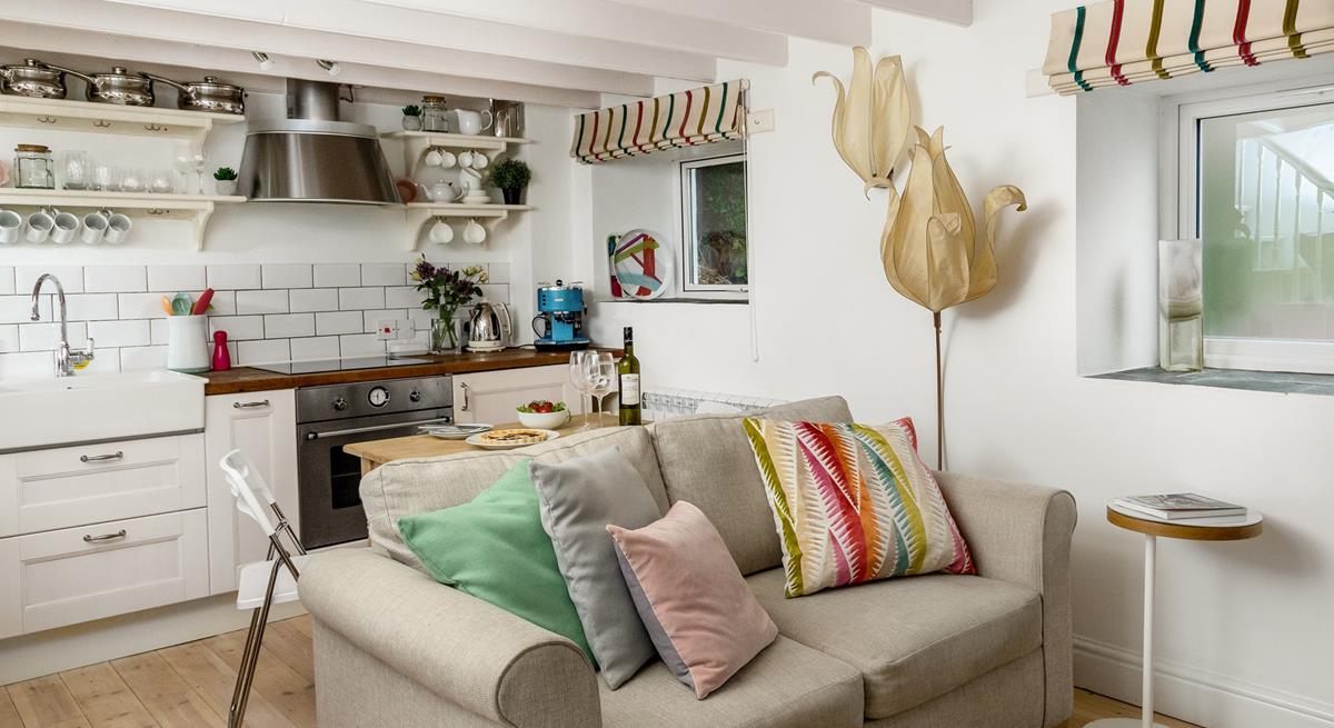 The open plan living space is perfectly equipped to create a base for your romantic getaway.