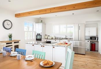 The stylish and well-equipped kitchen is perfect for the chef of a family to cook up a storm.