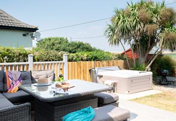 Enjoy wine and nibbles in the garden before unwinding in the steamy hot tub and taking in the rural views.