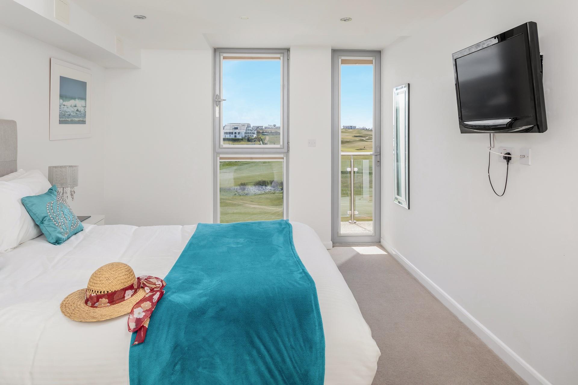 The main bedroom has a door leading out onto the second balcony, so you can step straight out of bed and breath in the fresh sea air. 