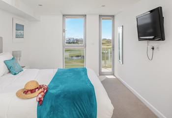 The main bedroom has a door leading out onto the second balcony, so you can step straight out of bed and breath in the fresh sea air. 