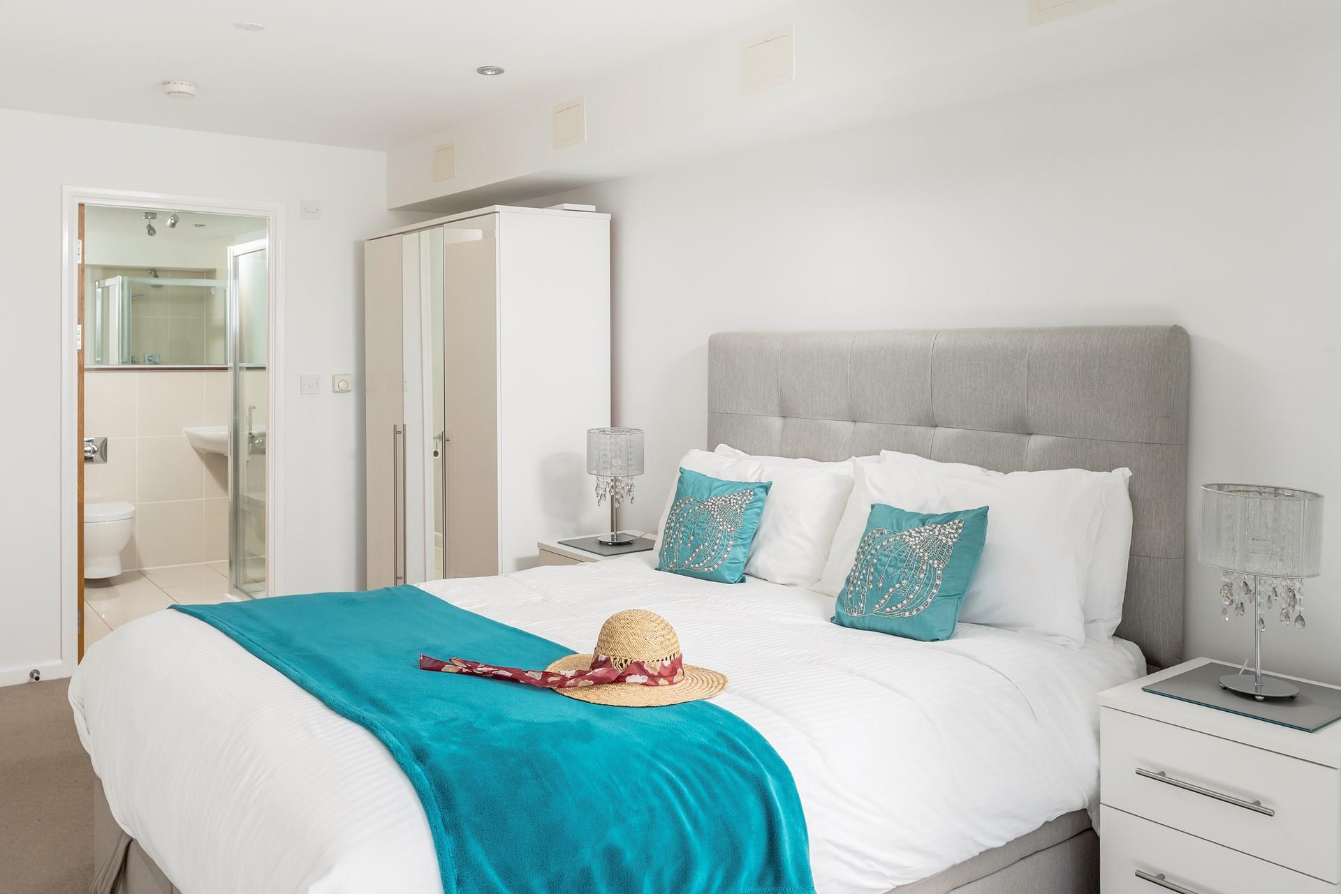 The main bedroom benefits from an en suite shower room, so you can get ready for a night out after a day at the beach.