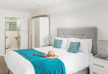 The main bedroom benefits from an en suite shower room, so you can get ready for a night out after a day at the beach.