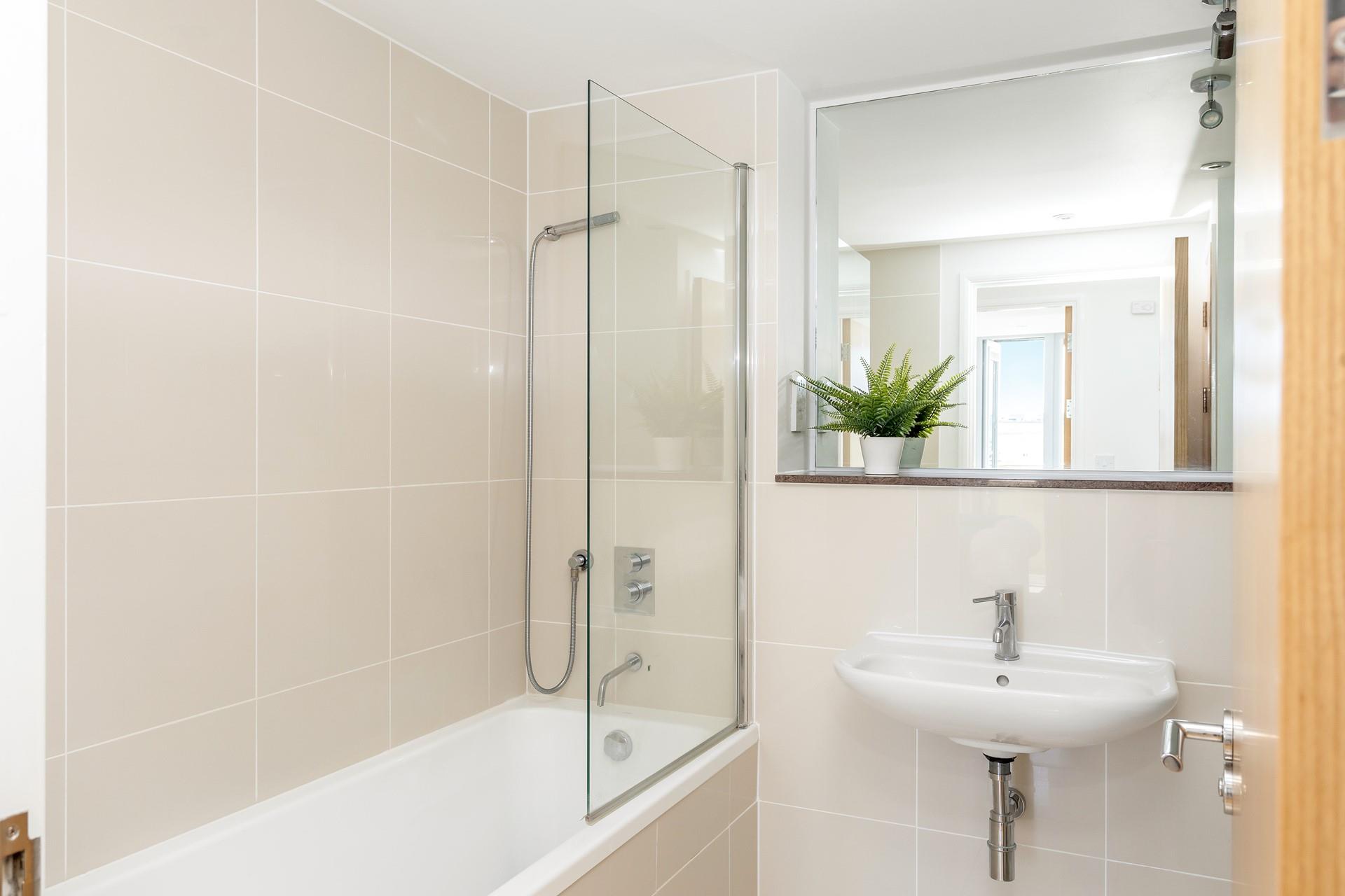 The family bathroom has a lovely deep bath, for soaking aching muscles after a day exploring the nearby coast paths. 
