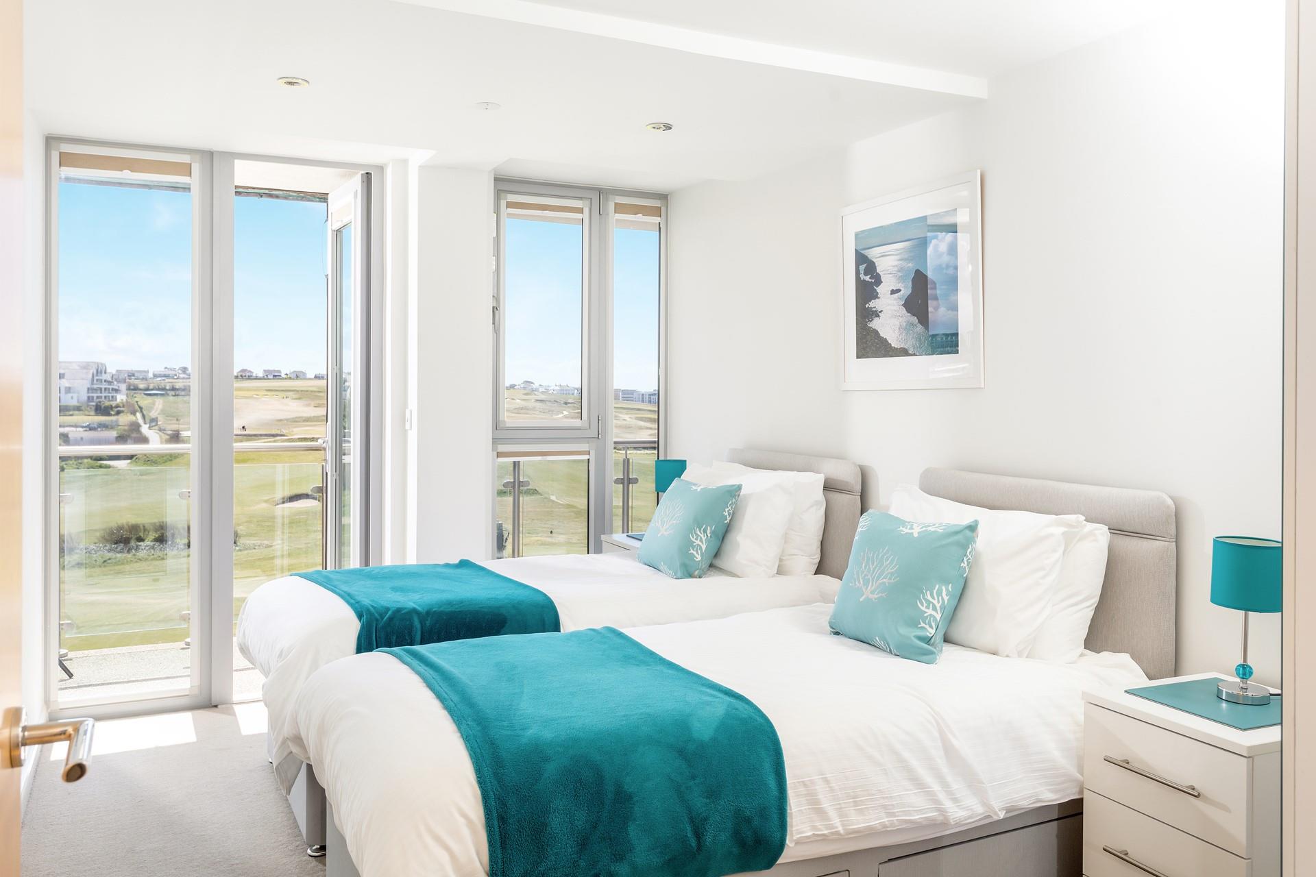 Comfortable twin beds and more beautiful views, a perfect place for catching up on some well deserved rest. 