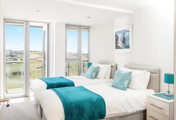 Comfortable twin beds and more beautiful views, a perfect place for catching up on some well deserved rest. 