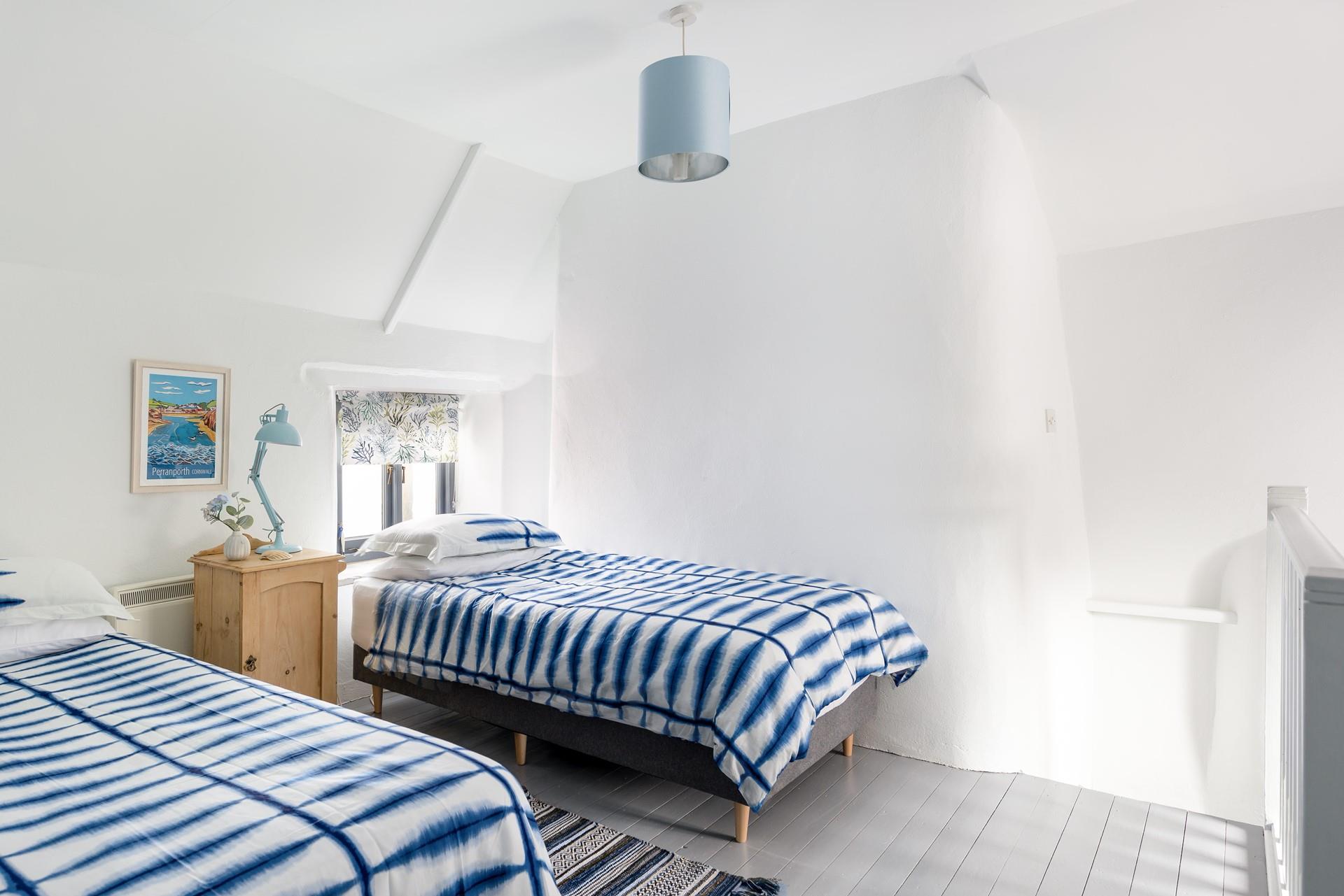 The twin room, which is accessed via the main bedroom, is light and airy.