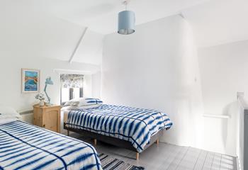 The twin room, which is accessed via the main bedroom, is light and airy.