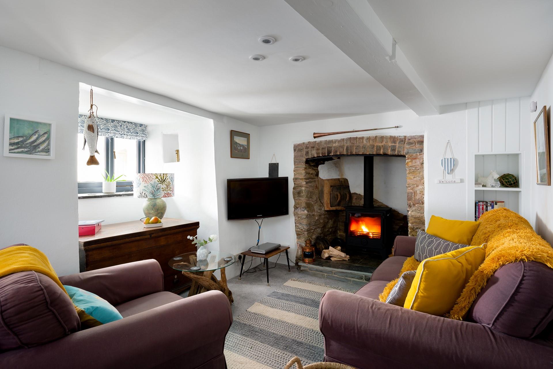 We love the feature fireplace, with granite surround, traditional wall oven and woodburner.