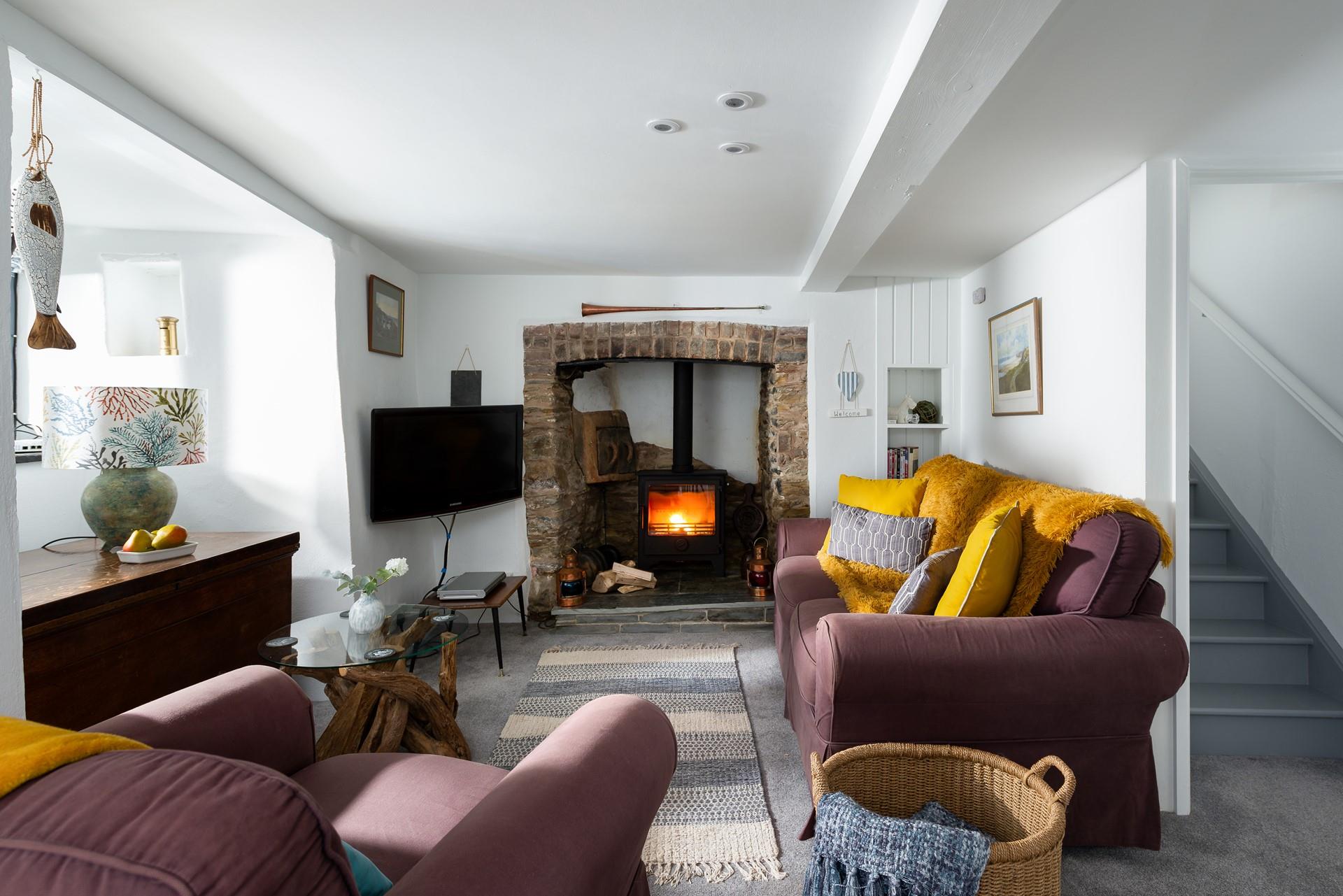 Beautifully traditional, the sitting room is cosy and comfortable, perfect for an evening in after a busy day out. 