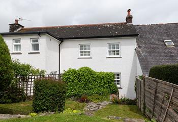 This gorgeous cottage has a cute garden to match. 