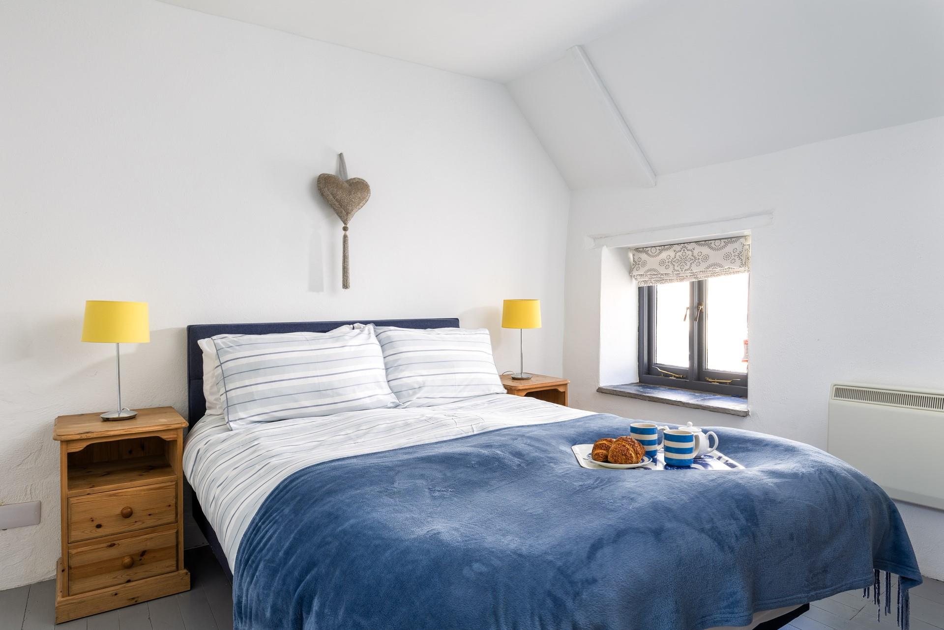 Light and spacious, Bedroom 1 benefits from a high ceiling. 