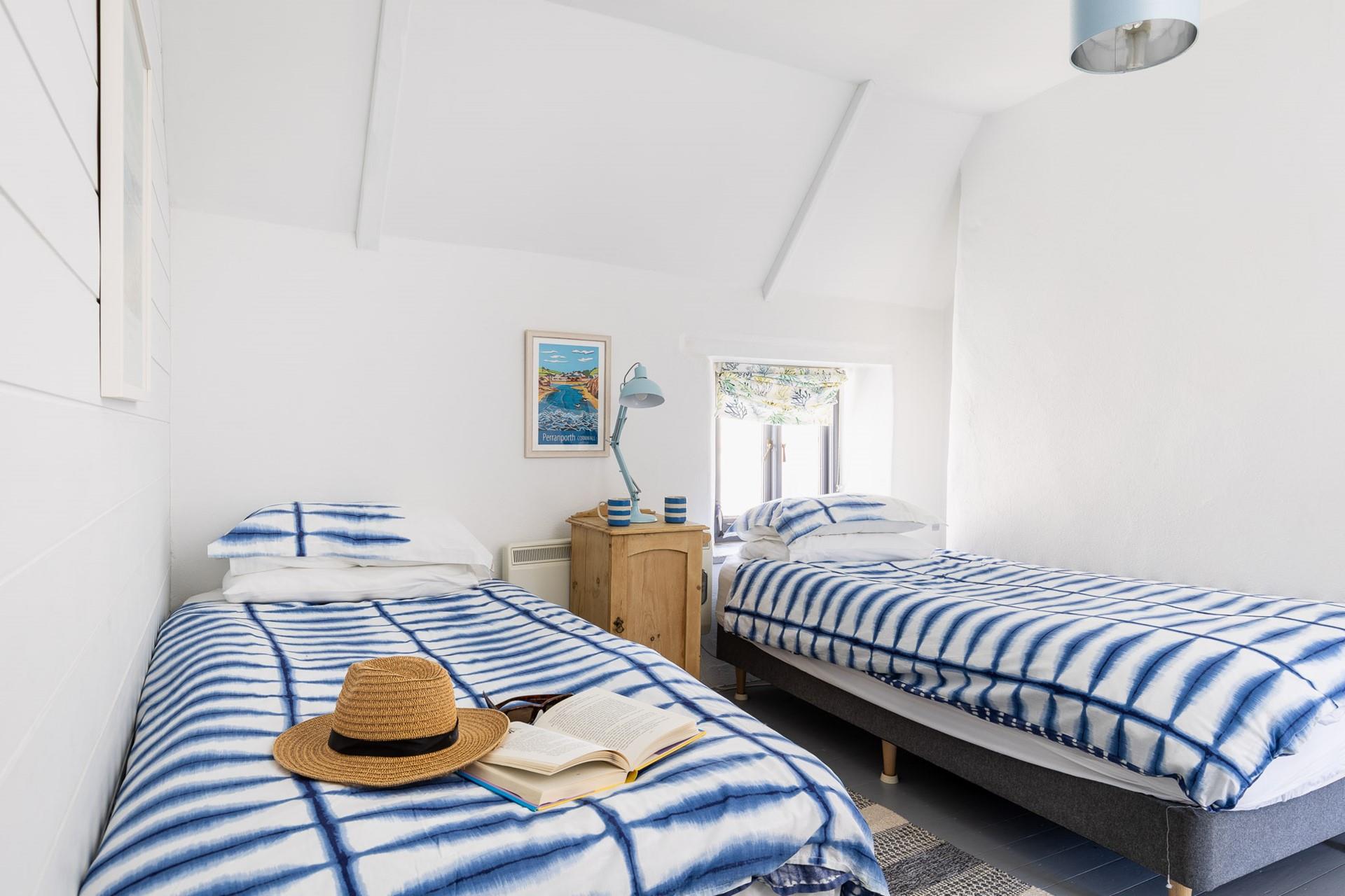 Bedroom 2 has twin beds, suitable for both children or adults.