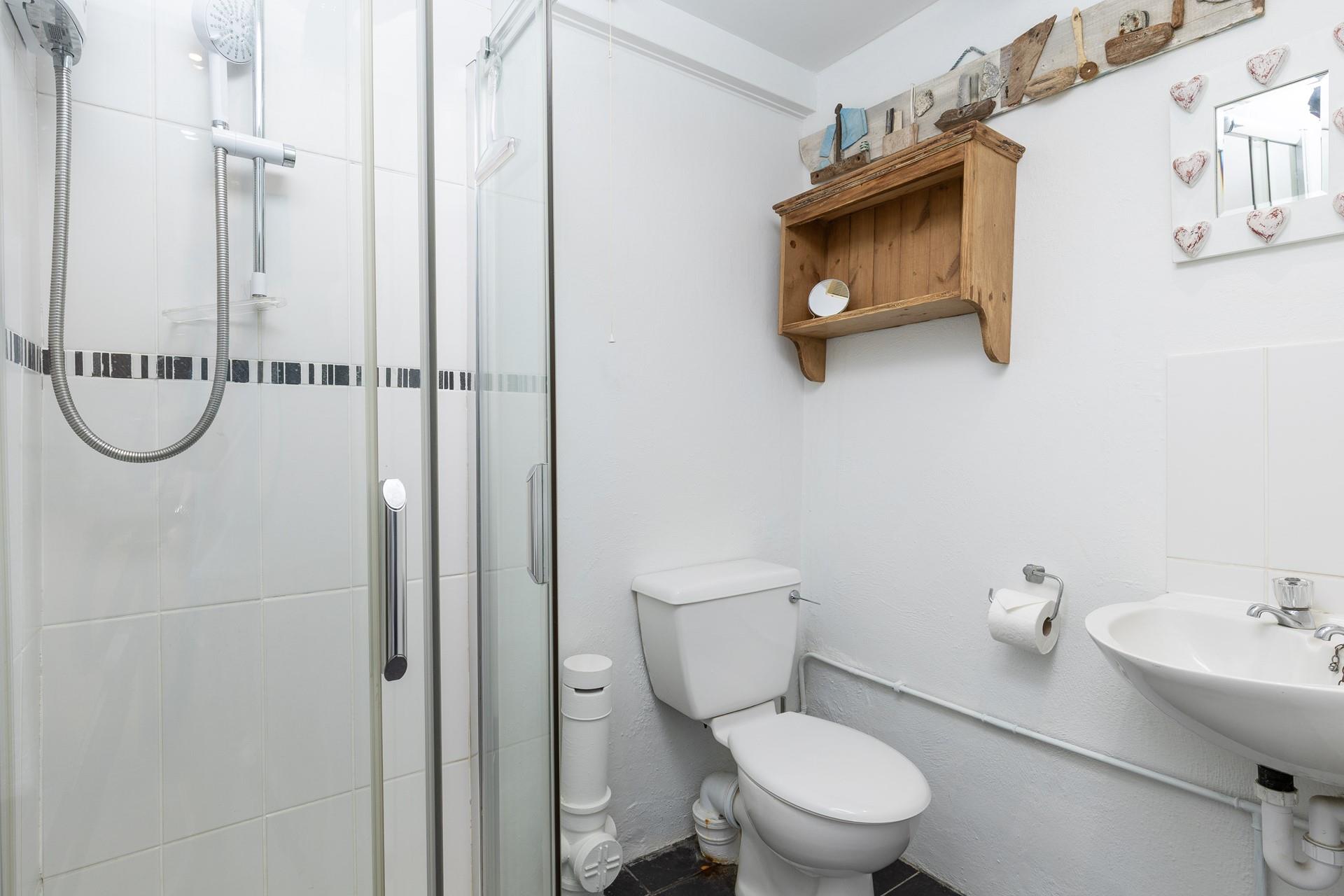 The shower room has a step-in shower.